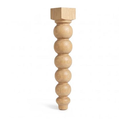 Milk Street bobbin leg front elevation on white, showing the square pommel and six stacked beads