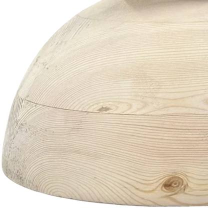 Two wooden spheres on a concrete floor with industrial background