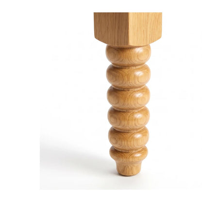 Close three-quarter detail of the bobbin bead run in oak on a white background