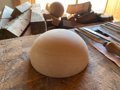 19 cm pine wooden hemisphere, hand-turned, on the workshop bench