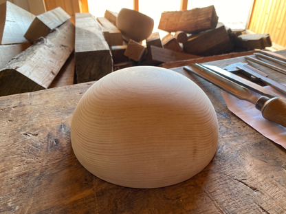 22 cm pine wooden hemisphere, hand-turned, on the workshop bench