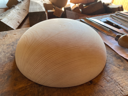 32 cm pine wooden hemisphere, hand-turned, on the workshop bench