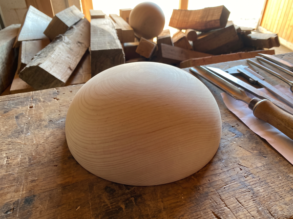 37 cm pine wooden hemisphere, hand-turned, on the workshop bench