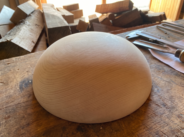 39 cm pine wooden hemisphere, hand-turned, on the workshop bench