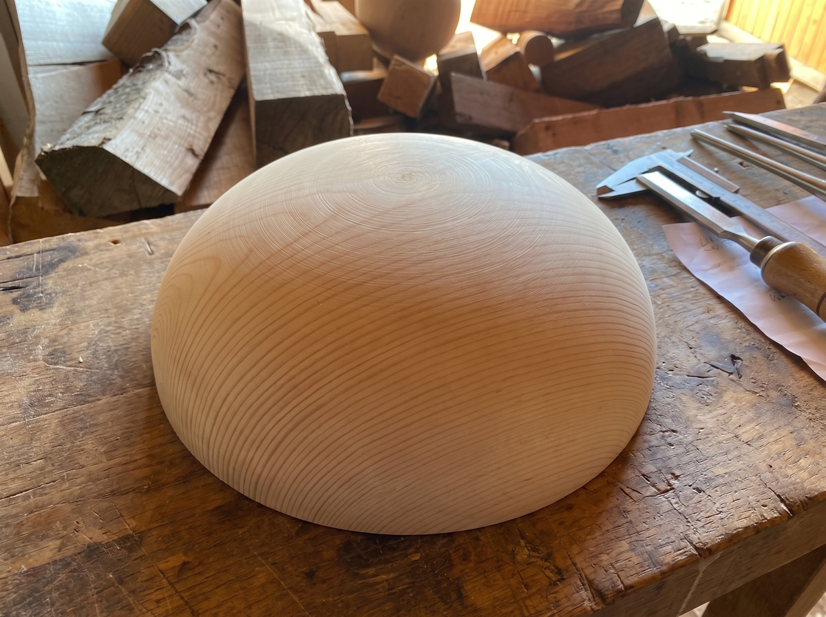 41 cm pine wooden hemisphere, hand-turned, on the workshop bench