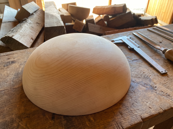 43 cm pine wooden hemisphere, hand-turned, on the workshop bench