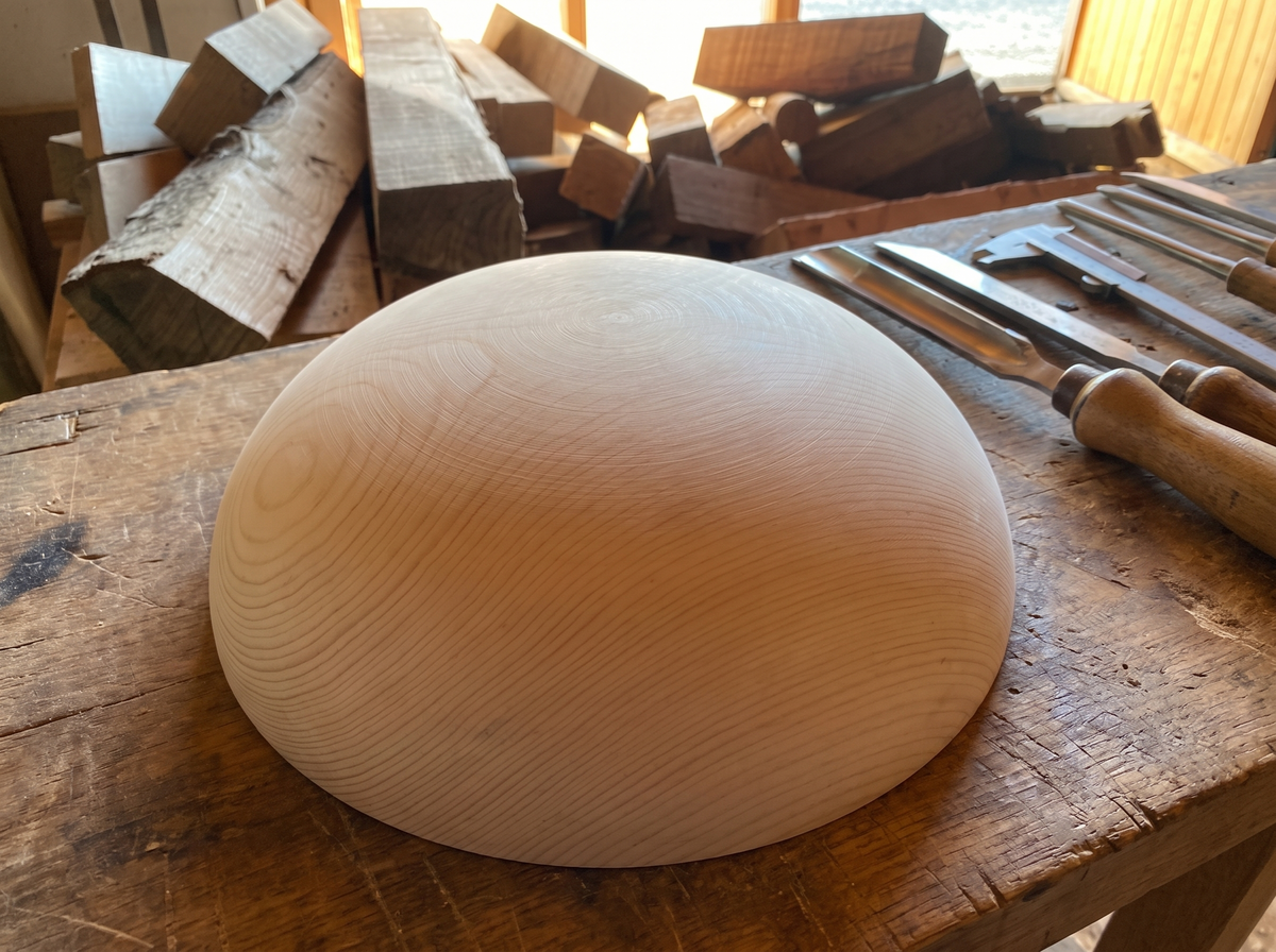 44 cm pine wooden hemisphere, hand-turned, on the workshop bench